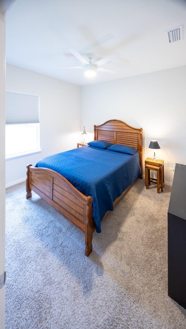 bedroom with ceiling fan and carpet