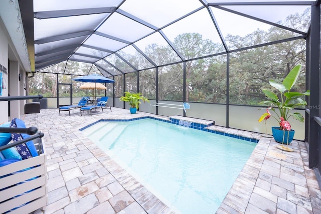 view of pool with a lanai and a patio area