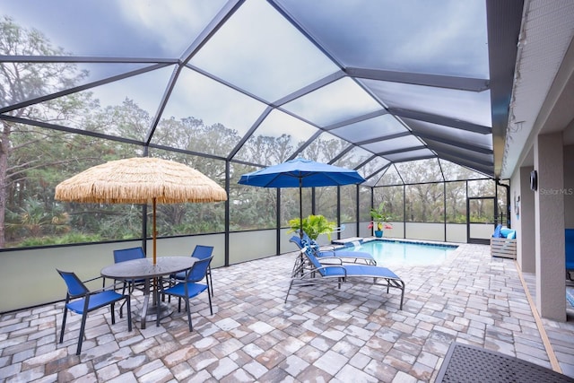 view of patio / terrace featuring a lanai