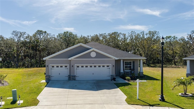 view of front of house featuring a garage and a front lawn