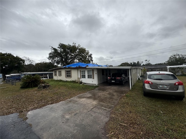 view of front of property with a carport