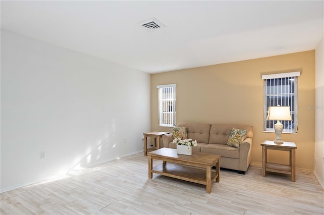 living room with light hardwood / wood-style flooring