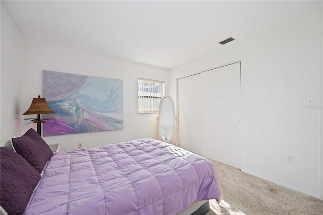 carpeted bedroom featuring a closet