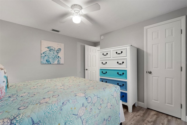 bedroom featuring ceiling fan and light hardwood / wood-style floors