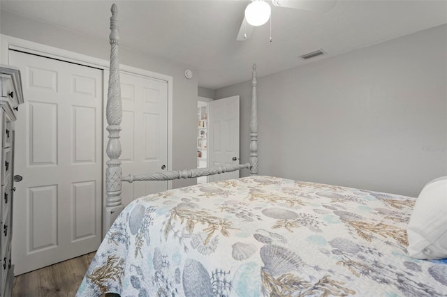 bedroom featuring ceiling fan, wood-type flooring, and a closet