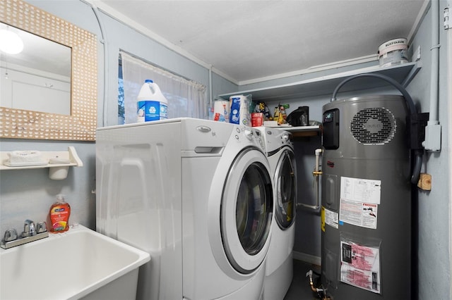 laundry room featuring heat pump water heater, ornamental molding, separate washer and dryer, and sink