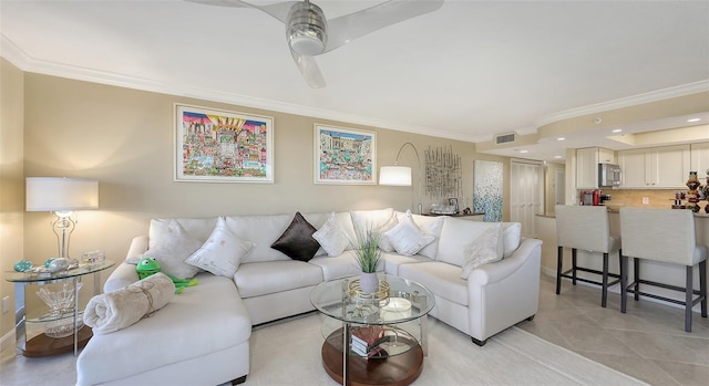 living room featuring crown molding and ceiling fan