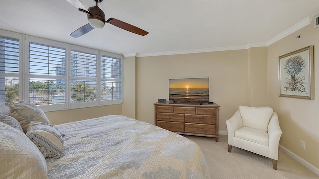 carpeted bedroom featuring crown molding and ceiling fan