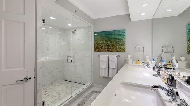 bathroom featuring vanity, crown molding, and a shower with shower door