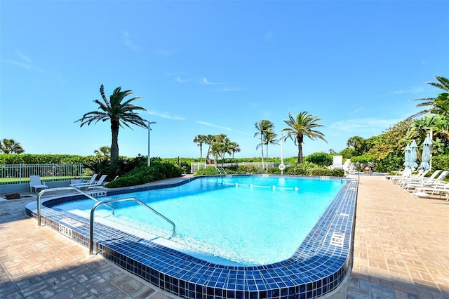 view of swimming pool featuring a patio area