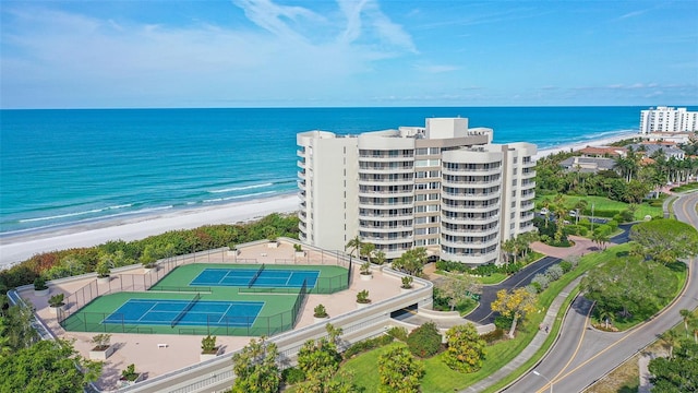 bird's eye view with a water view and a view of the beach