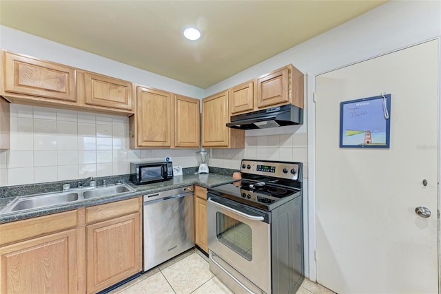 kitchen with stainless steel appliances, sink, light tile patterned floors, and backsplash