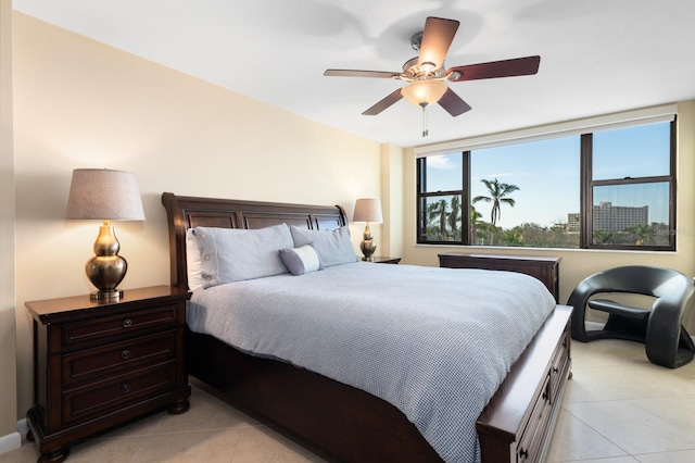 bedroom featuring light tile patterned floors and ceiling fan