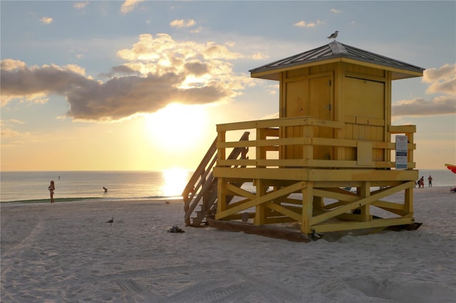 view of property's community featuring a water view and a view of the beach