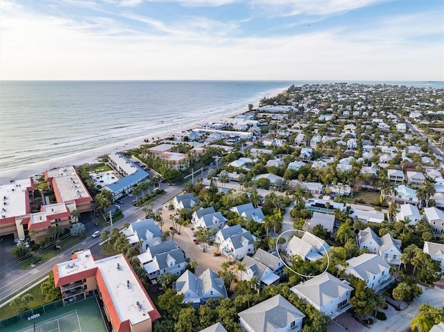 bird's eye view featuring a water view and a beach view