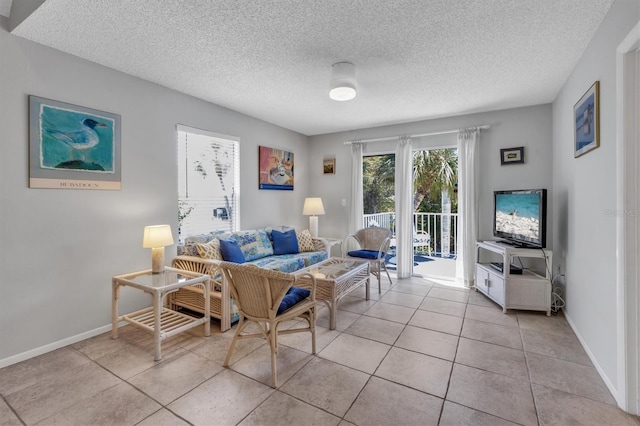 tiled living room with a textured ceiling