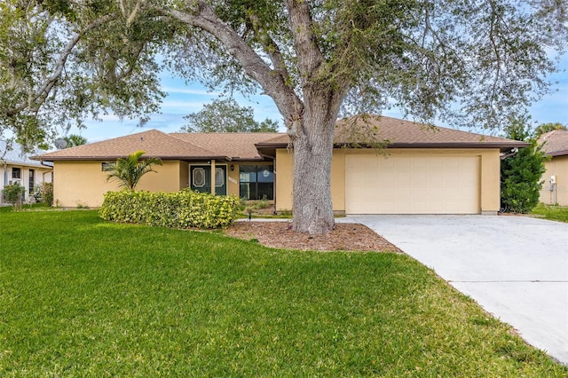 single story home featuring a garage and a front lawn