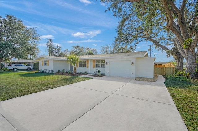 ranch-style home featuring a garage and a front lawn