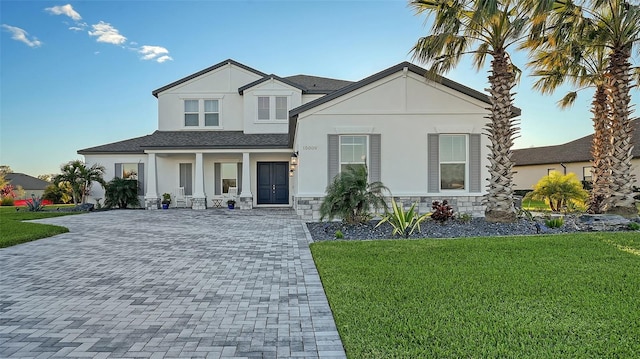 view of front of home featuring a front lawn and a porch