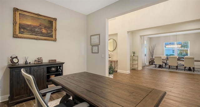 home office with hardwood / wood-style floors