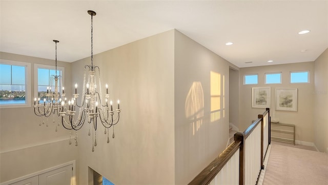 details featuring a water view, a chandelier, and carpet floors