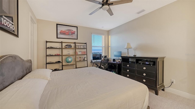 bedroom featuring ceiling fan and carpet