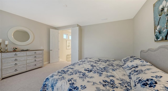 bedroom with light colored carpet