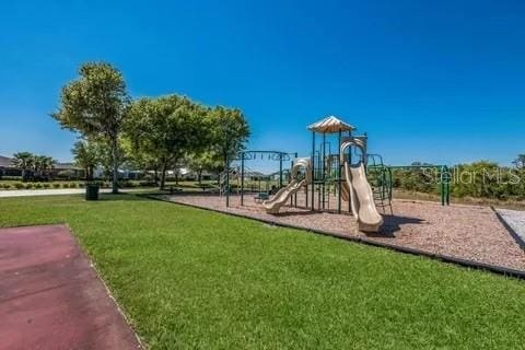 view of playground featuring a lawn