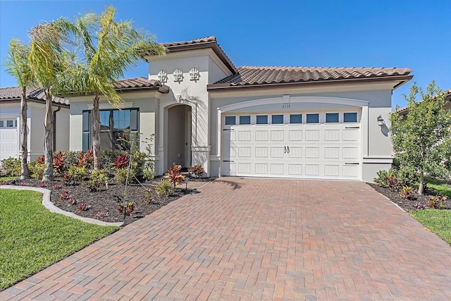 mediterranean / spanish-style house featuring a garage