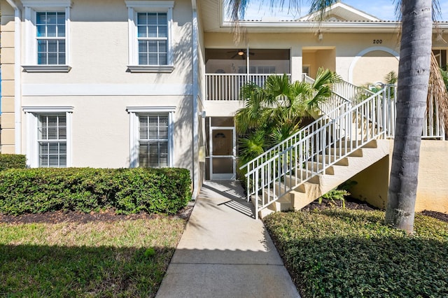 exterior space featuring ceiling fan