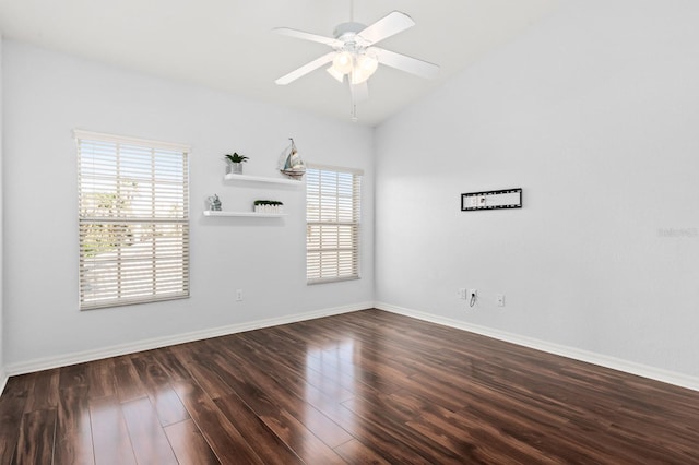 unfurnished room with lofted ceiling, dark wood-type flooring, and ceiling fan