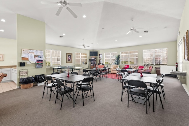 carpeted dining room with a healthy amount of sunlight