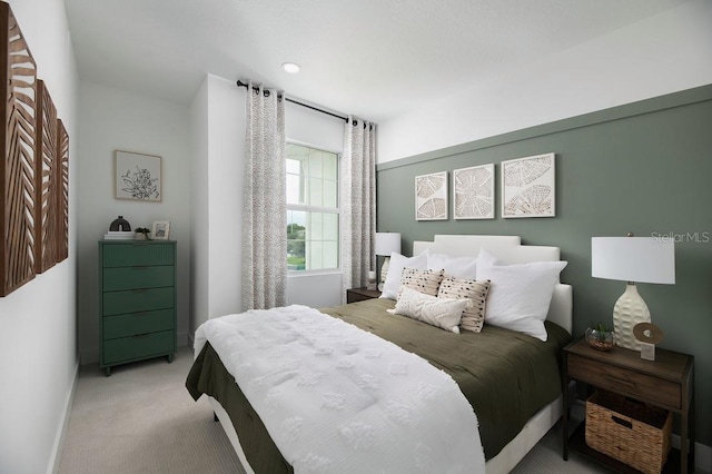 bedroom featuring light carpet