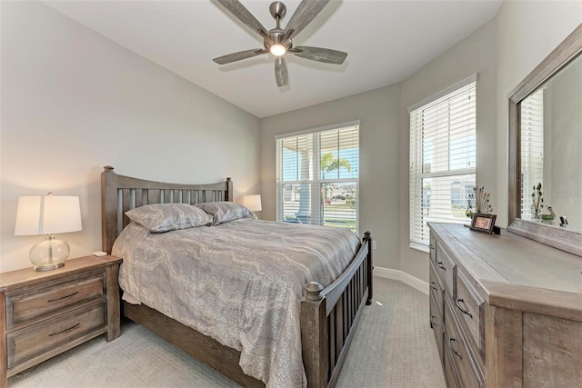 carpeted bedroom with vaulted ceiling and ceiling fan