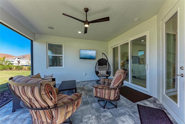 view of patio / terrace featuring ceiling fan