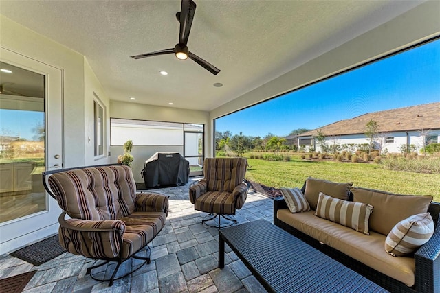 view of patio with ceiling fan, outdoor lounge area, and area for grilling