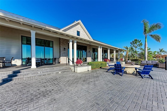 view of patio with an outdoor fire pit