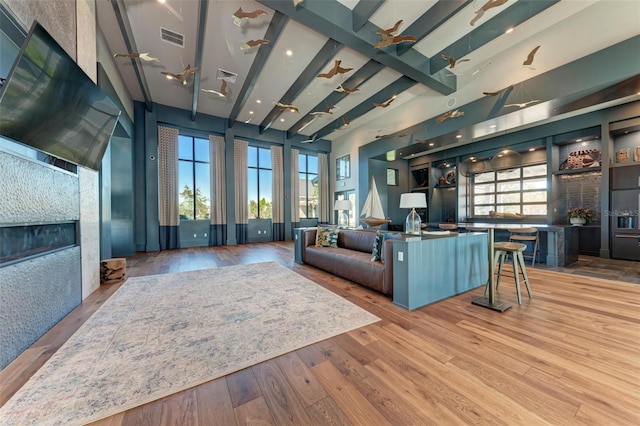 living room with wood-type flooring and plenty of natural light