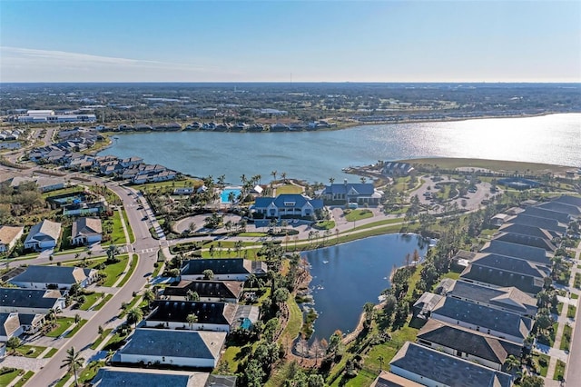 drone / aerial view with a water view