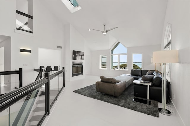 living room featuring high vaulted ceiling and ceiling fan