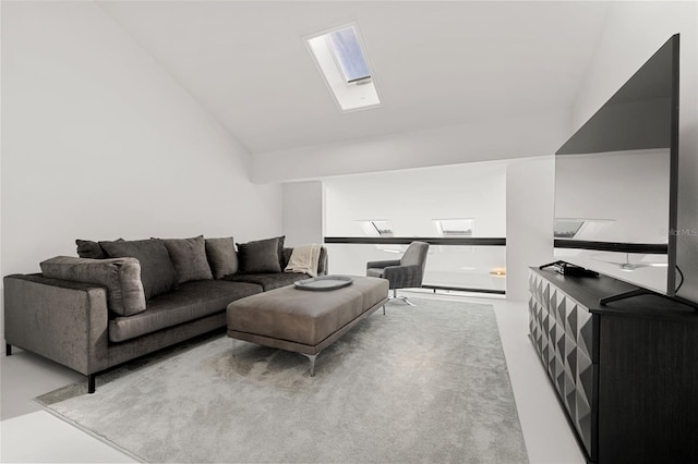 living room featuring lofted ceiling with skylight