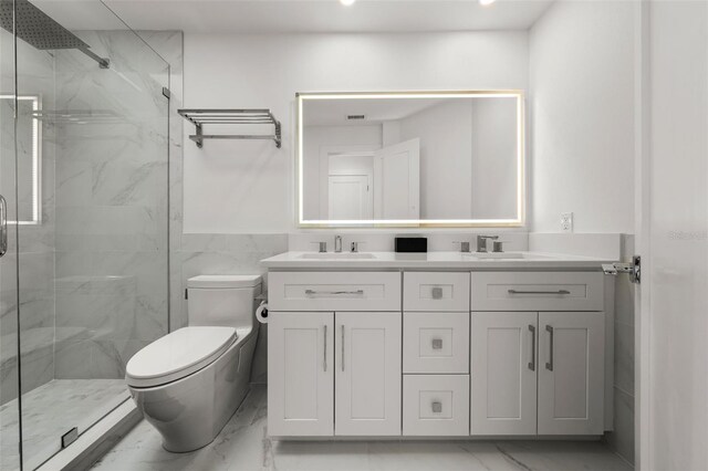 bathroom with vanity, toilet, and a shower with shower door