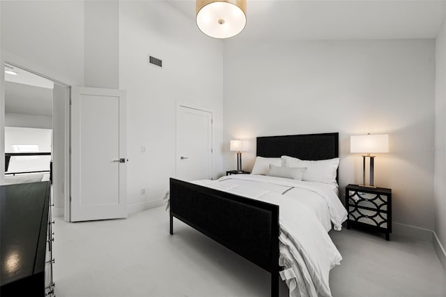 bedroom featuring a high ceiling