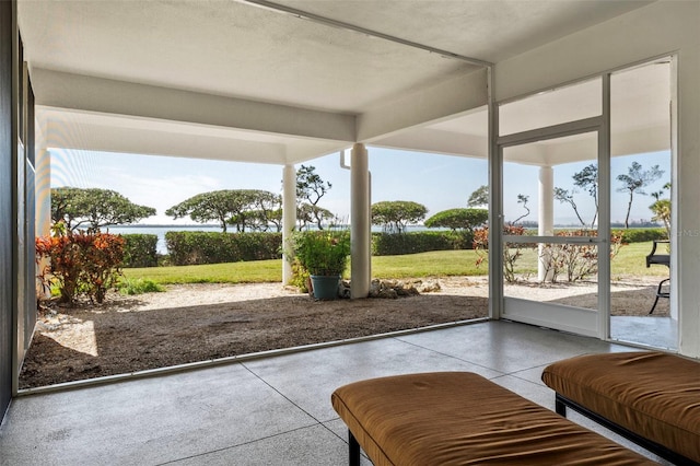 doorway featuring concrete floors and a healthy amount of sunlight