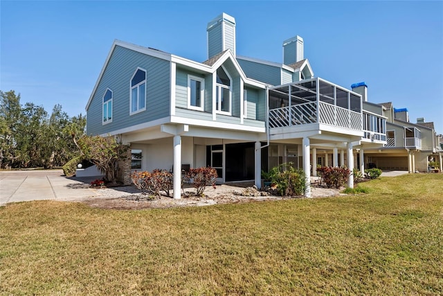 rear view of property featuring a yard