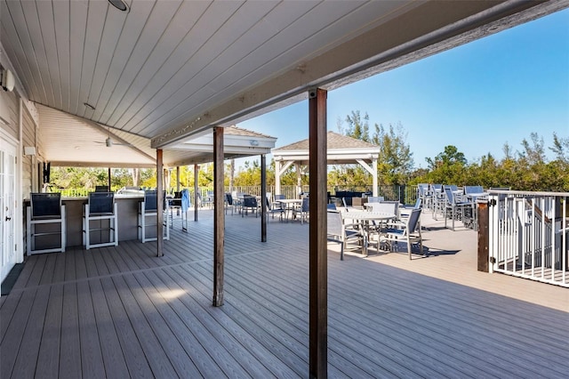 wooden deck featuring a bar