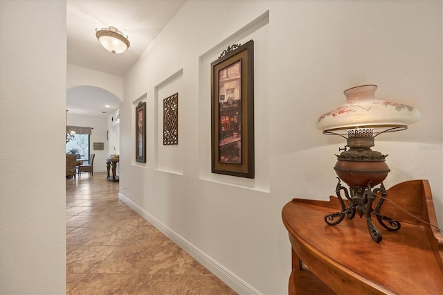 corridor featuring light tile patterned floors