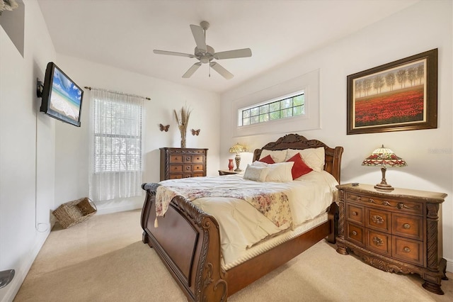 bedroom featuring ceiling fan and light carpet