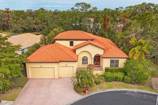 mediterranean / spanish house featuring a garage