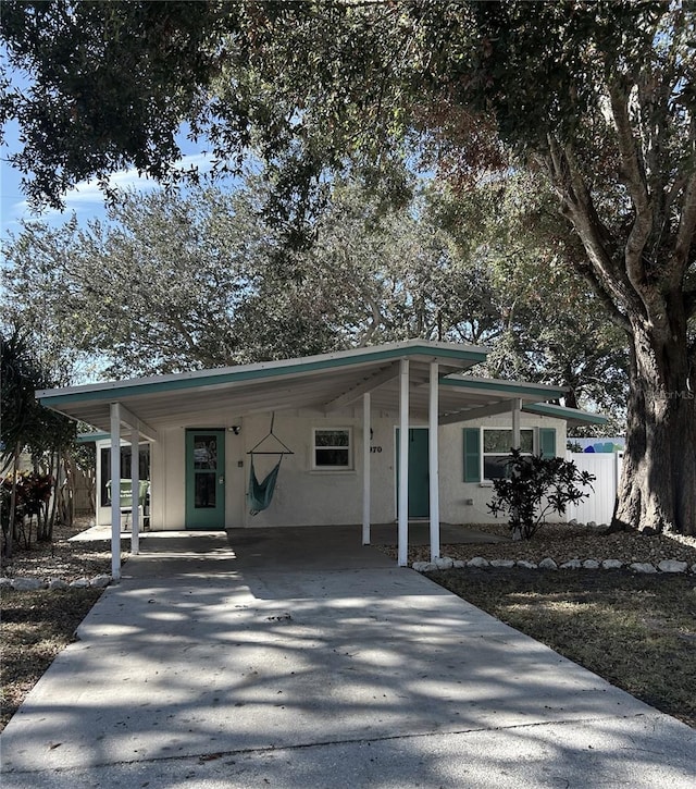 view of front of home featuring a carport